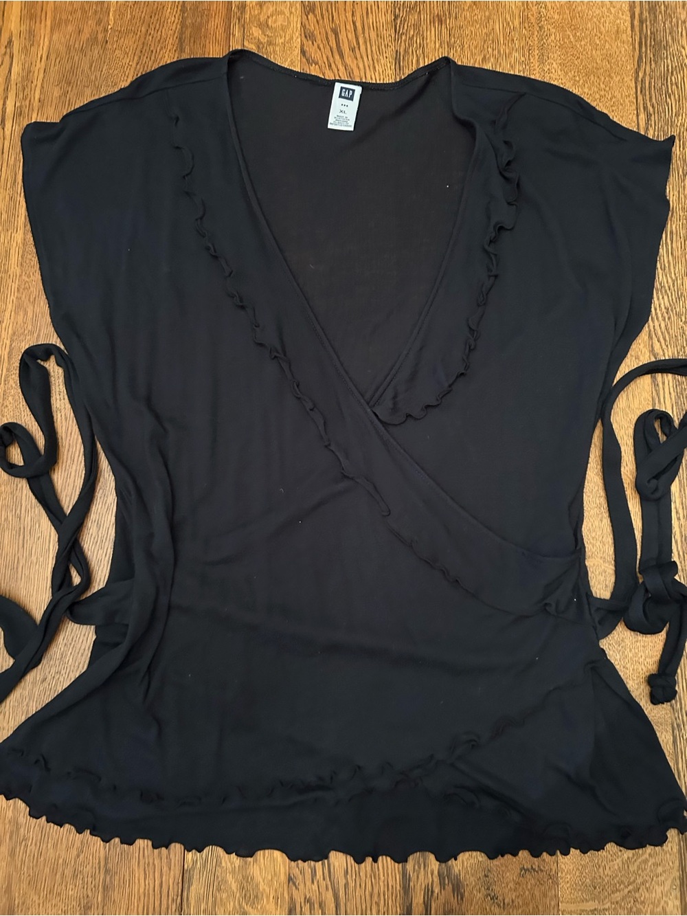 GAP Black Wrap Blouse w/Ruffle Trim. Attached long side belts wrap all around.